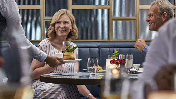 A couple dining in the Supper Club on Spirit of Adventure